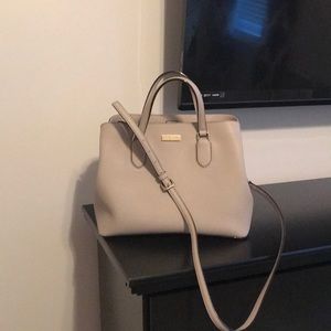 Grey Kate Spade handbag with shoulder strap